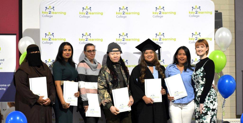 Key 2 Learning College 2024 graduates in caps and gowns